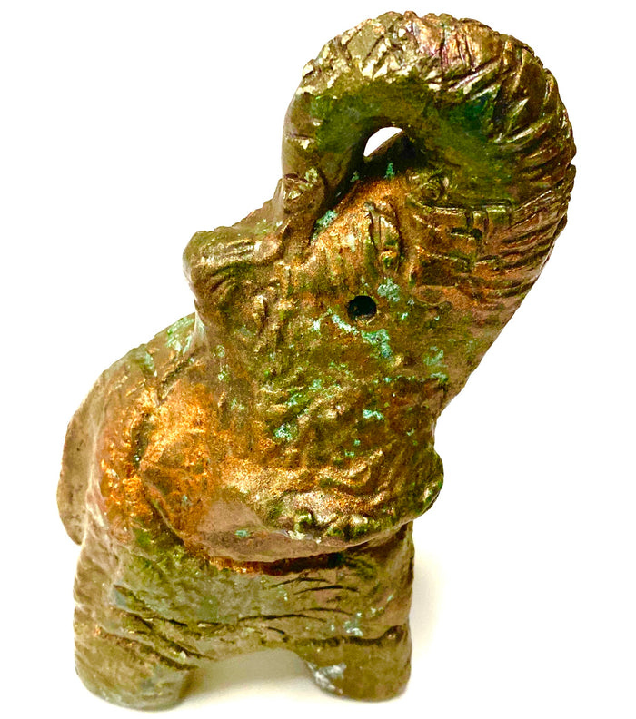 Raku Elephant Have you HERD!!!!!! Just one of these lovely Raku Fired Elephant will make an excellent gift for your friend, sorority or for your home’ special place centerpiece. 5" x 2" x 3" 1lbs Beautiful metallic raku elephant For decorative purposely only.