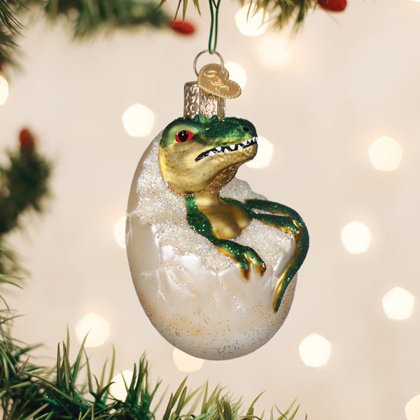 Baby dinosaur hatching from an egg glass Christmas ornament