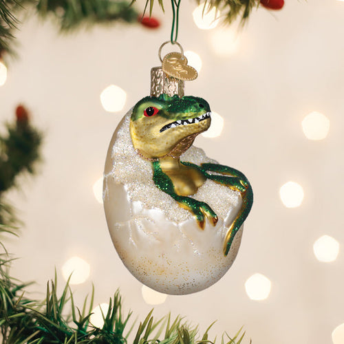 Baby dinosaur hatching from an egg glass Christmas ornament