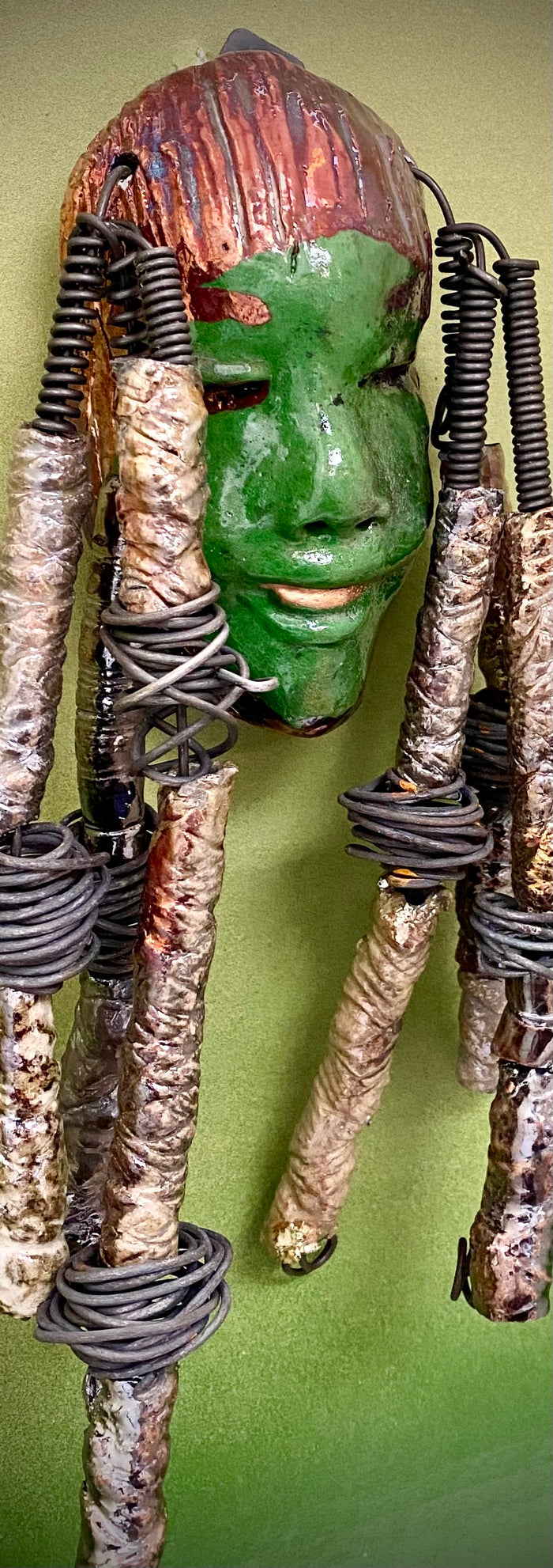 I started making art soon after seeing authentic African artwork at the Smithsonian Museum of African Art. I was in total awe. Bryce was inspired by my visit there.  Bryce is 4”x 10” and weighs 1  lbs. She has an  awesome emerald green complexion. Bryce wears a textured copper headdress with textured metallic white spiral coiled beads of hair. Bryce is ready to be installed in your home!