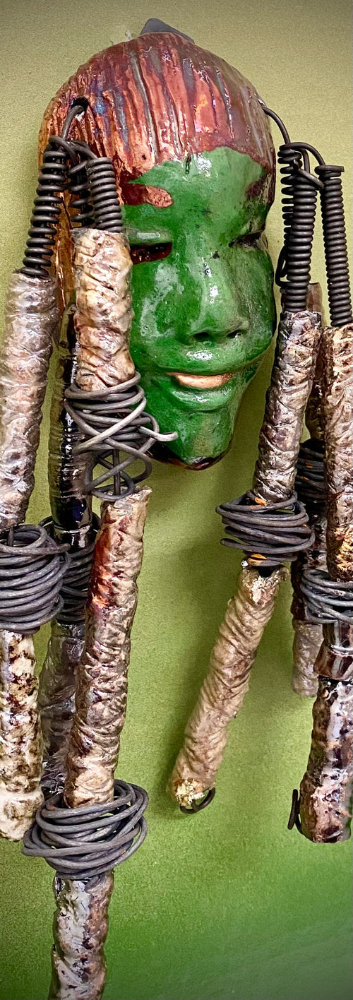 I started making art soon after seeing authentic African artwork at the Smithsonian Museum of African Art. I was in total awe. Bryce was inspired by my visit there.  Bryce is 4”x 10” and weighs 1  lbs. She has an  awesome emerald green complexion. Bryce wears a textured copper headdress with textured metallic white spiral coiled beads of hair. Bryce is ready to be installed in your home!