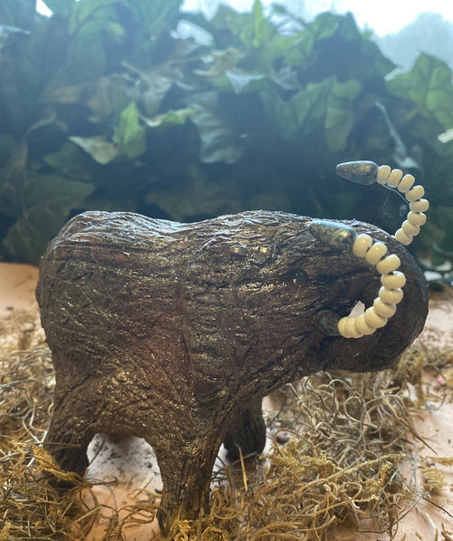 Have you HERD!!!!!!     Elephants are one of my favorite animals to create. They are so majestic"  Just one of these lovely Raku Fired Elephant will make an excellent gift for your  BFF,  or just for you .    This raku fired elephant sits 4.5" x 3" x 4" and weighs 1 lbs. She has beaded tusks and a textured copper charcoal body. This one will be nice to add your Herdew Collection!