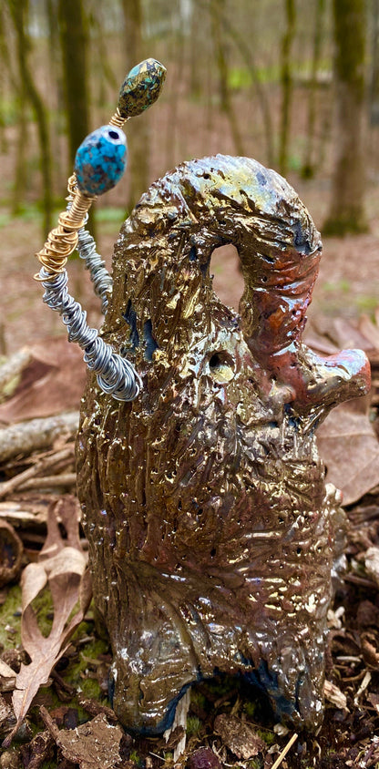 Raku Elephant Have you HERD!!!!!!  Just one of these lovely Raku Fired Elephant will make an excellent gift for your  friend, sorority or for your home’ special place centerpiece.   6.5" x 3" x 4" 10 ozs Silver and gold beaded tusk Beautiful  gold metallic raku elephant For decorative purposely only