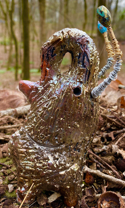 Raku Elephant Have you HERD!!!!!!  Just one of these lovely Raku Fired Elephant will make an excellent gift for your  friend, sorority or for your home’ special place centerpiece.   6.5" x 3" x 4" 10 ozs Silver and gold beaded tusk Beautiful  gold metallic raku elephant For decorative purposely only