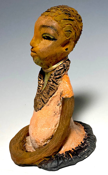 Meet Ernestine! Ernestine stands 7" x 5”x 5" and weighs  1.4 lbs.  Ernestine has a lovely pale pink dress with a gold wire necklace.    Ernestine appears to sit in a yoga pose. Her long arms rest at her side. With the current situation we All are facing, Ernestine will place a smile on your face during this challenging time. If not, return her within 30 days for a complete refund.                Gift Cards are available!!