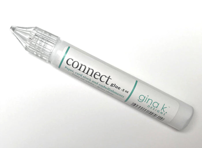 Gina K. Designs - Adhesive - Connect Glue. Connect Glue will hold your project together! This glue comes in a convenient pen style applicator and works great with paper, embellishments, felt and more! .5 oz. - Goes on white, dries crystal clear. Includes one tube of glue. Available at Embellish Away located in Bowmanville Ontario Canada.