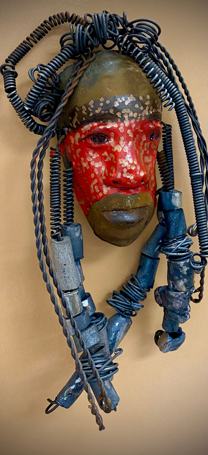 Meet Mackenzie! I started making art soon after seeing authentic African artwork at the Smithsonian Museum of African Art. I was in total awe.  Mackenzie was inspired by my visit there.  Mackenzie is 5”x 11” and weighs 1 lbs. She has a two tone copper matte and red complexion. Mackenzie has spiral coils and handmade beads for hair. She is ready to be installed in your home!