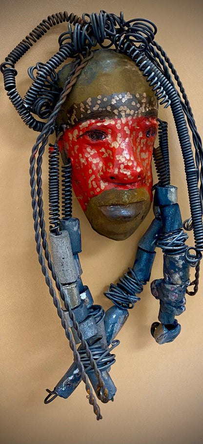 Meet Mackenzie! I started making art soon after seeing authentic African artwork at the Smithsonian Museum of African Art. I was in total awe.  Mackenzie was inspired by my visit there.  Mackenzie is 5”x 11” and weighs 1 lbs. She has a two tone copper matte and red complexion. Mackenzie has spiral coils and handmade beads for hair. She is ready to be installed in your home!