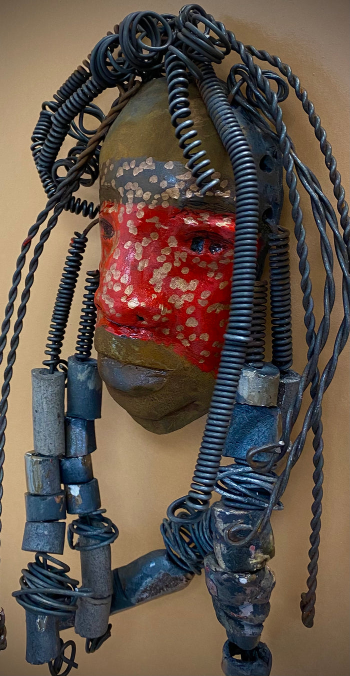 Meet Mackenzie! I started making art soon after seeing authentic African artwork at the Smithsonian Museum of African Art. I was in total awe.  Mackenzie was inspired by my visit there.  Mackenzie is 5”x 11” and weighs 1 lbs. She has a two tone copper matte and red complexion. Mackenzie has spiral coils and handmade beads for hair. She is ready to be installed in your home!