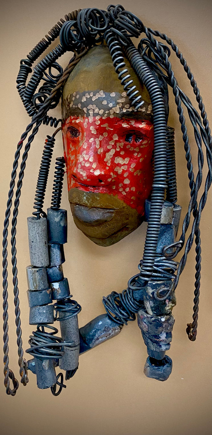 Meet Mackenzie! I started making art soon after seeing authentic African artwork at the Smithsonian Museum of African Art. I was in total awe.  Mackenzie was inspired by my visit there.  Mackenzie is 5”x 11” and weighs 1 lbs. She has a two tone copper matte and red complexion. Mackenzie has spiral coils and handmade beads for hair. She is ready to be installed in your home!