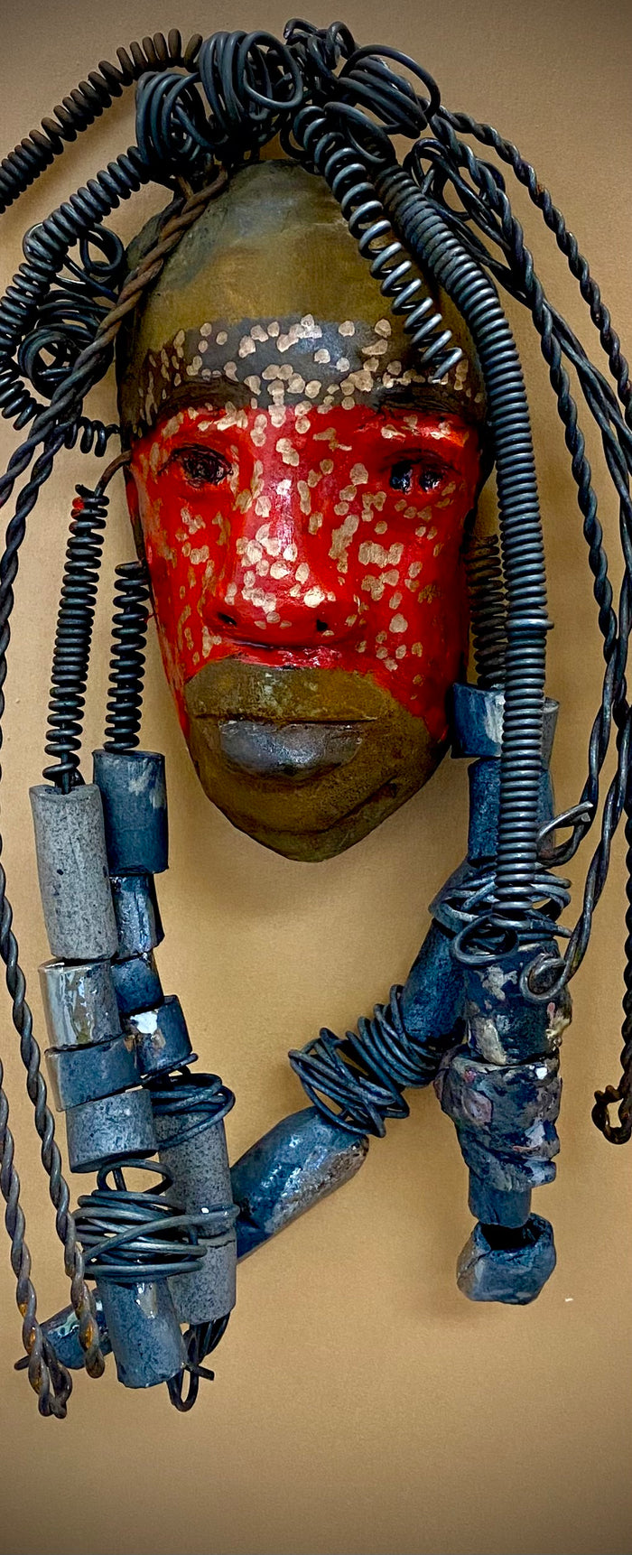 Meet Mackenzie! I started making art soon after seeing authentic African artwork at the Smithsonian Museum of African Art. I was in total awe.  Mackenzie was inspired by my visit there.  Mackenzie is 5”x 11” and weighs 1 lbs. She has a two tone copper matte and red complexion. Mackenzie has spiral coils and handmade beads for hair. She is ready to be installed in your home!