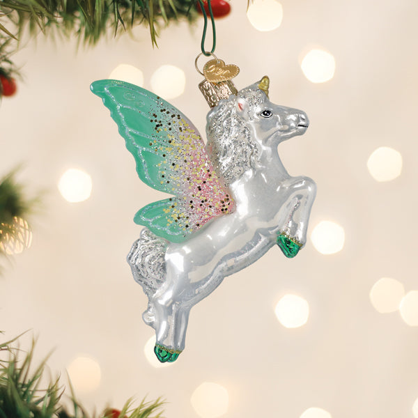 Radiant Pegasus glass ornament with pastel wings hanging on a Christmas tree