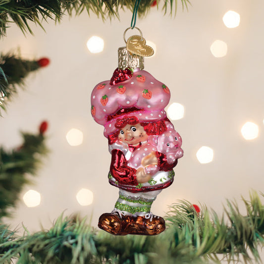Strawberry Shortcake and Custard glass ornament hanging on a Christmas tree