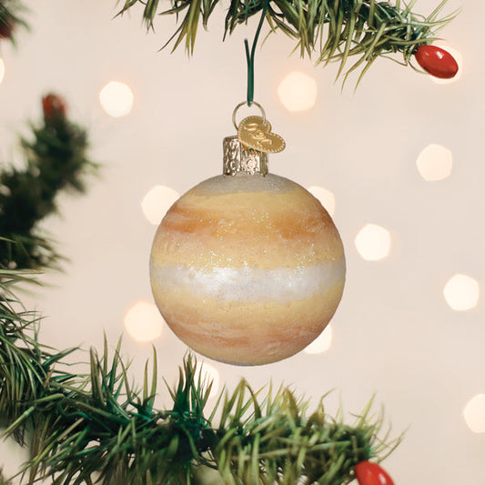 Venus planet glass ornament in golden tones hanging on a Christmas tree