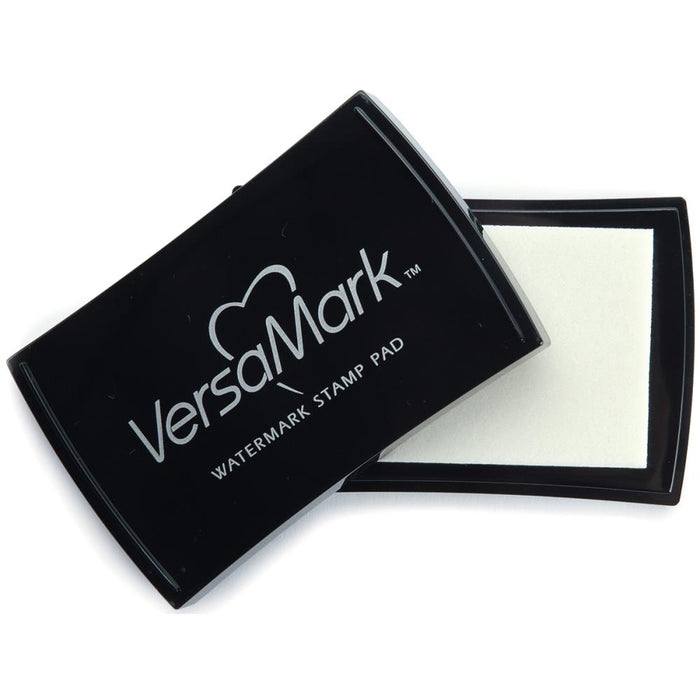 Imagine - VersaMark - Watermark Stamp Pad. VERSAMARK-Watermark Inkpad by Tsukineko contains clear watermark ink. You will not believe what you can do with just one ink pad! A necessity for every crafter. Easy for beginning stampers to use, but versatile enough for experienced stamp artists to create unparalleled masterpieces. Available at Embellish Away located in Bowmanville Ontario Canada.